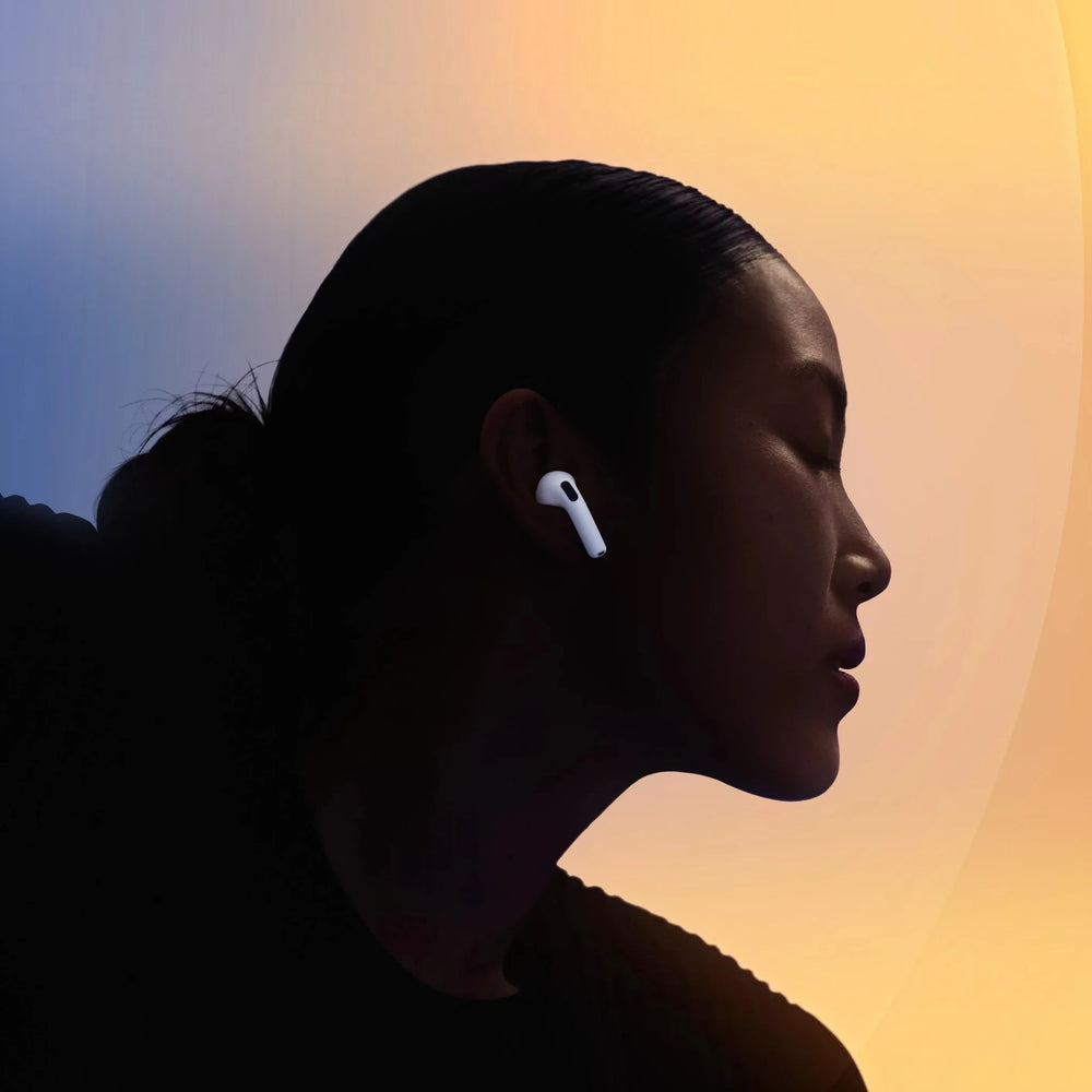 alAsil Apple AirPods 5 with H2 chip and Active Noise Cancellation worn by a woman in a soft gradient light setting