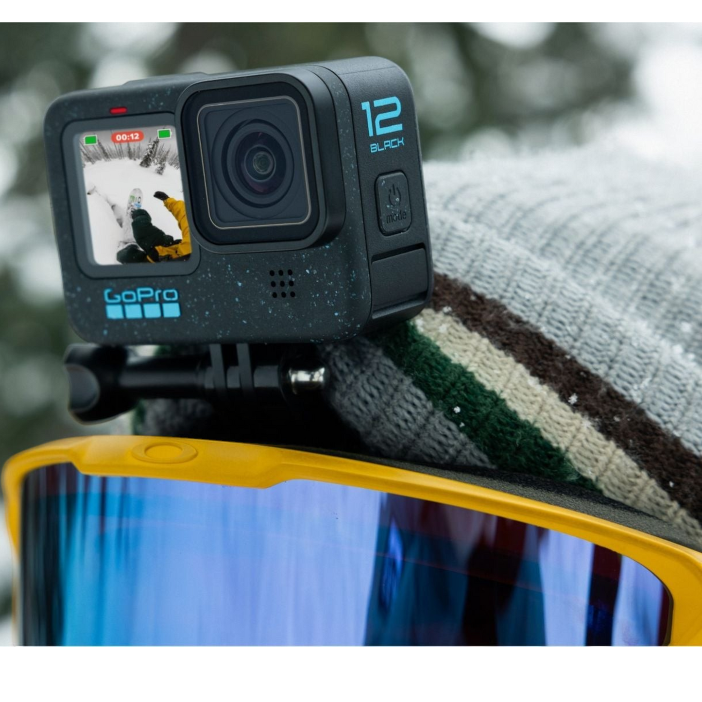 alAsil GoPro HERO12 Black action camera mounted on a skier's helmet with yellow goggles, capturing snowy mountain views.