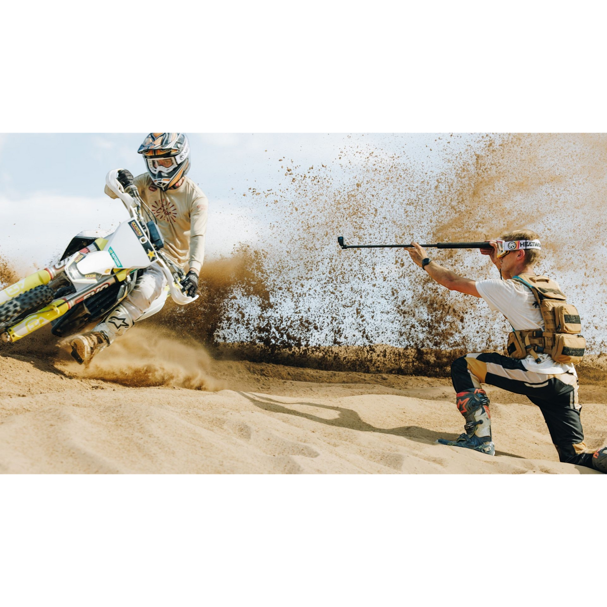 alAsil GoPro HERO13 Black action camera capturing a motocross rider kicking up sand in the desert