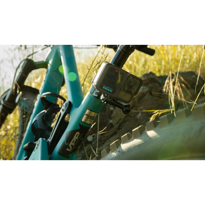 alAsil GoPro HERO13 Black action camera mounted on a teal mountain bike frame outdoors in sunlight