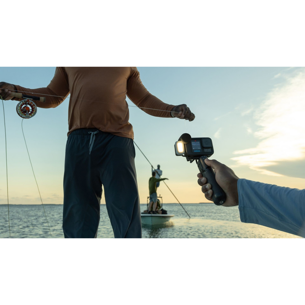 alAsil GoPro HERO13 Black Creator Edition camera held on a battery grip filming a person fly fishing on a boat