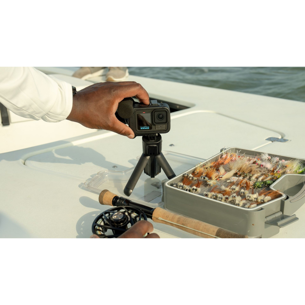alAsil GoPro HERO13 Black Creator Edition camera on a tripod being set up for fishing vlog on a boat