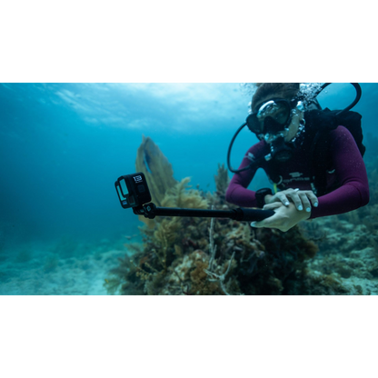 alAsil GoPro HERO13 Black action camera mounted on a selfie stick held by a scuba diver exploring an underwater reef