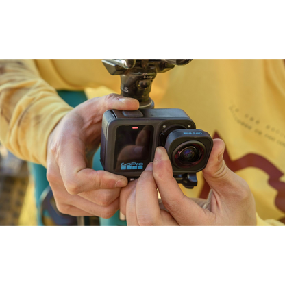alAsil GoPro HERO13 Black action camera with Ultra Wide Lens Mod being attached by hands for immersive POV shots