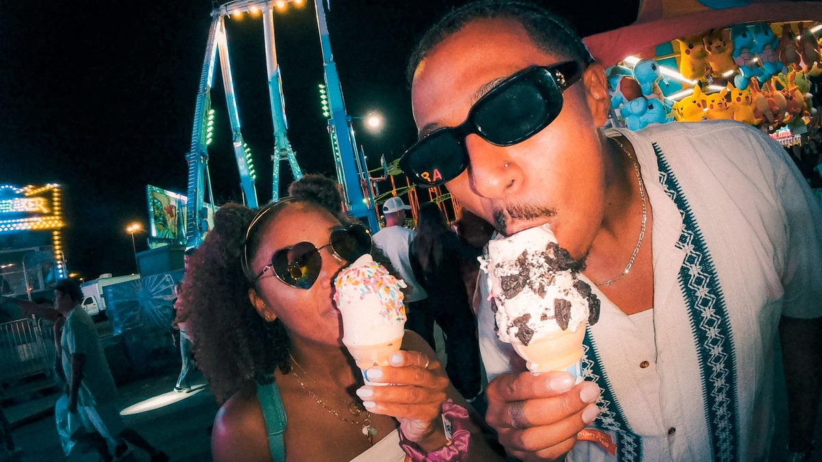 alAsil GoPro LIT HERO action camera captures a couple eating ice cream at a night carnival with clear low-light video