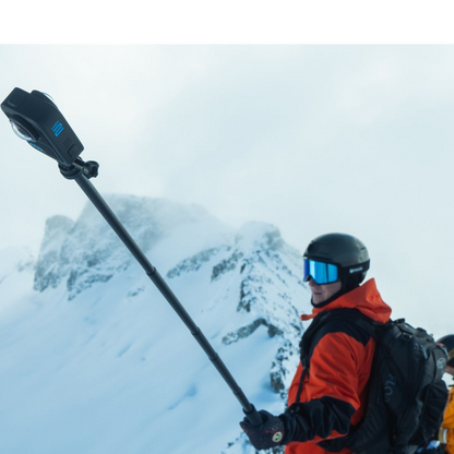 alAsil GoPro MAX2 360 camera mounted on an extension pole held by a skier on a snowy mountain peak