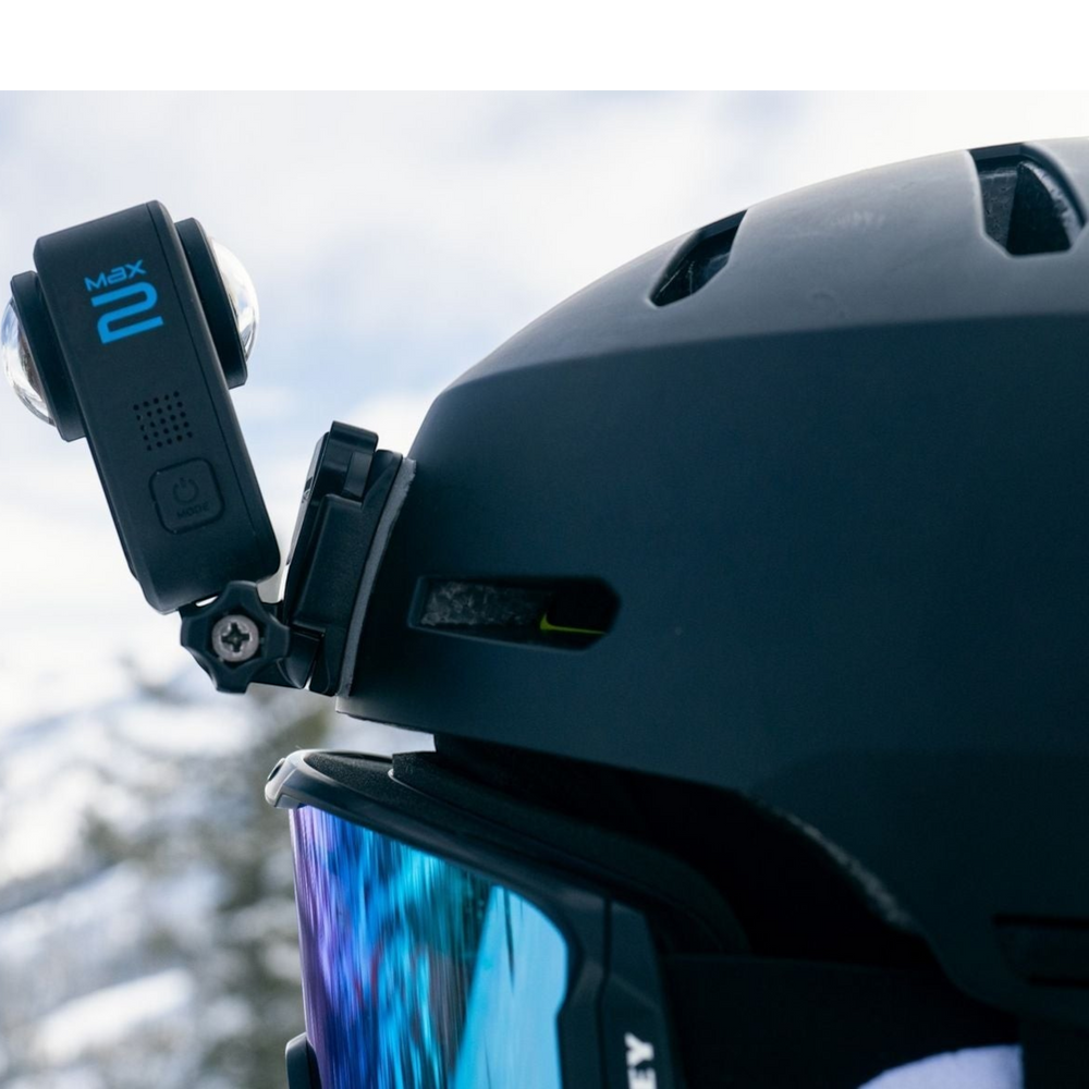 alAsil GoPro MAX2 360 camera mounted on a black ski helmet with blue mirrored goggles in a snowy outdoor setting.