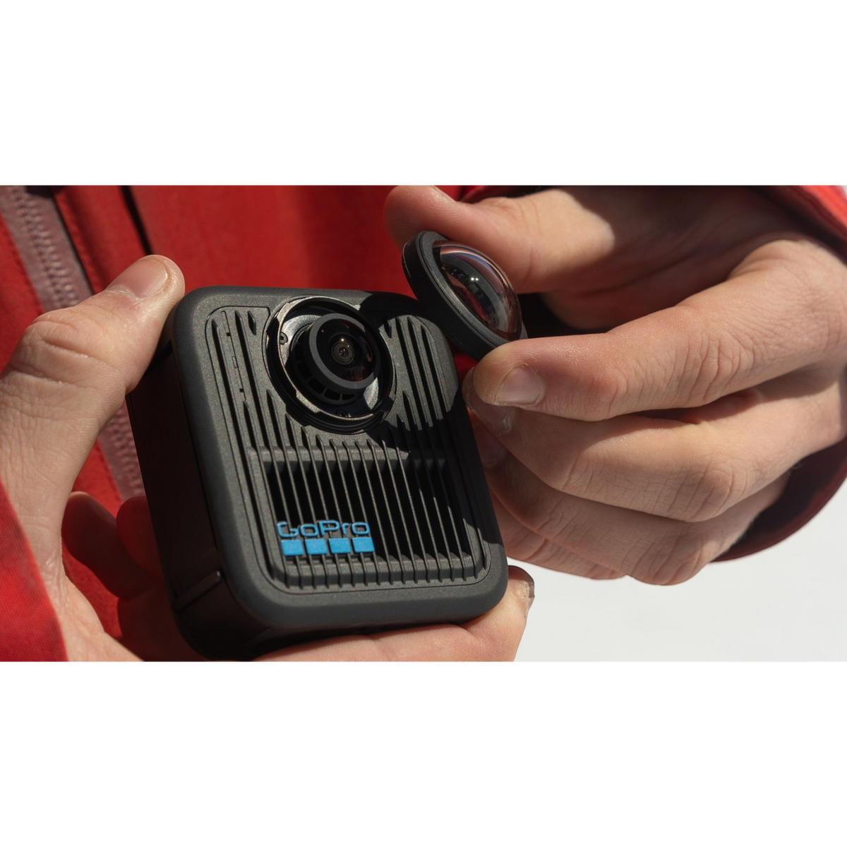 alAsil GoPro MAX2 360 camera with a user removing the protective lens cover for maintenance or replacement