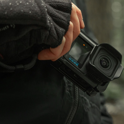 alAsil GoPro MISSION 1 cinema camera held in a hand, featuring a rugged black body and 1-inch sensor lens.