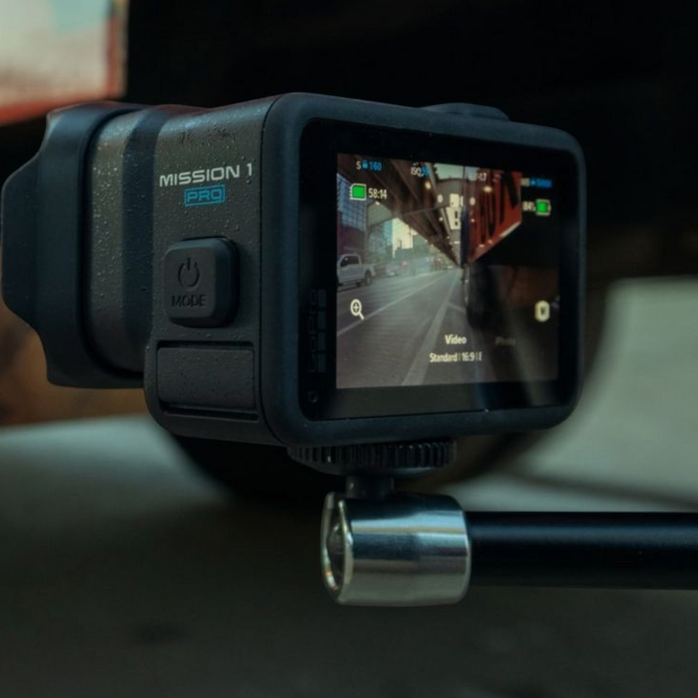 alAsil GoPro MISSION 1 PRO cinema camera mounted on a pole showing the rear touchscreen display with video settings
