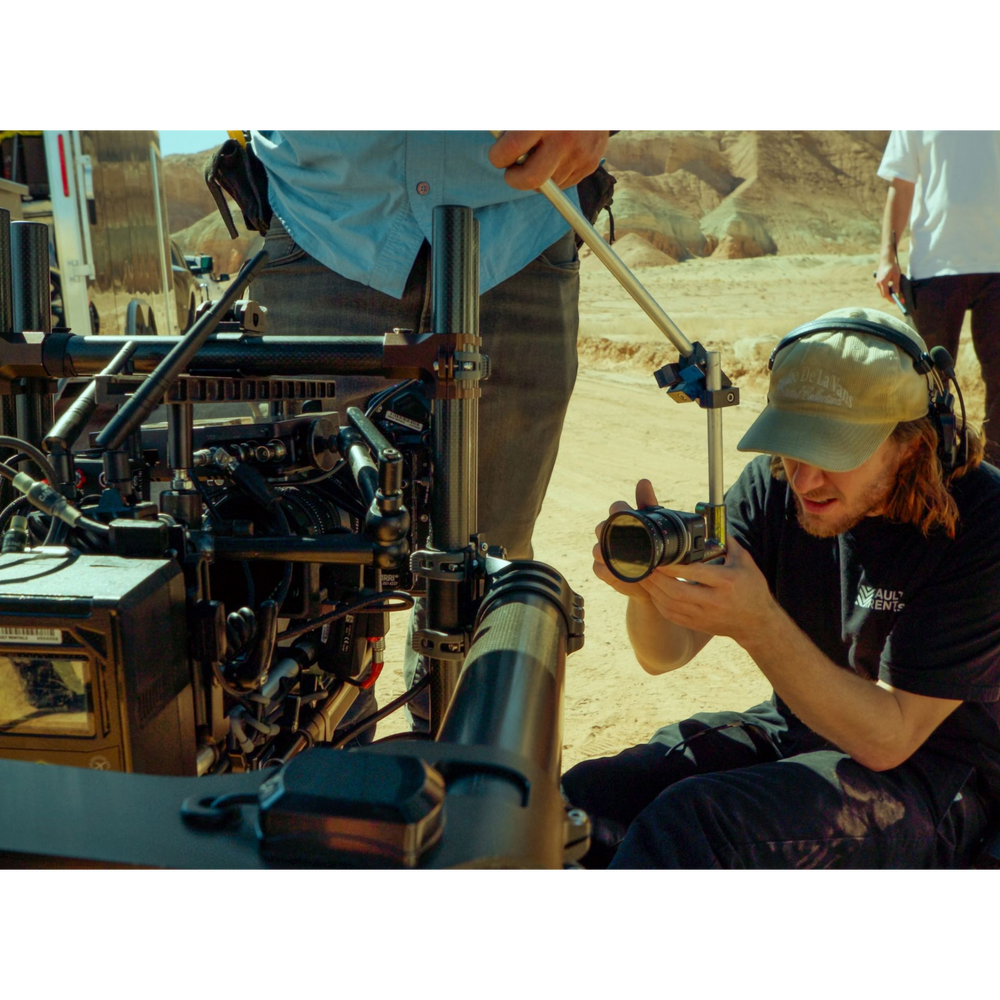 alAsil GoPro MISSION 1 PRO ILS cinema camera mounted on a professional rig with a filmmaker adjusting the lens