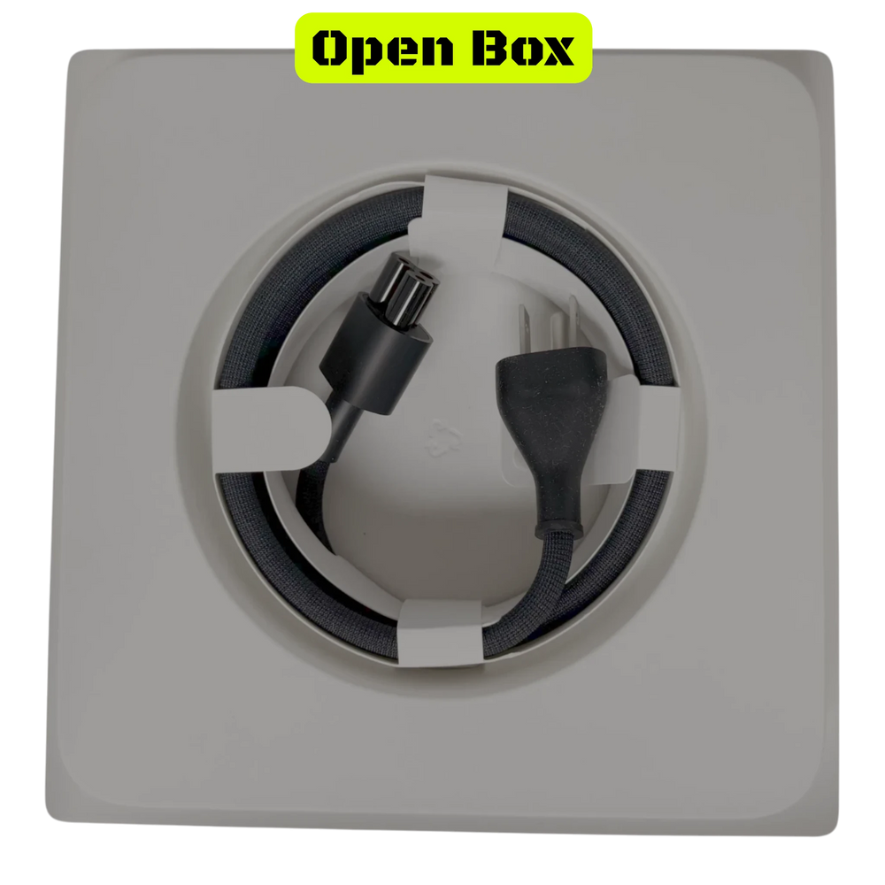 alAsil open box Apple Mac Studio power cable coiled inside white packaging accessory tray
