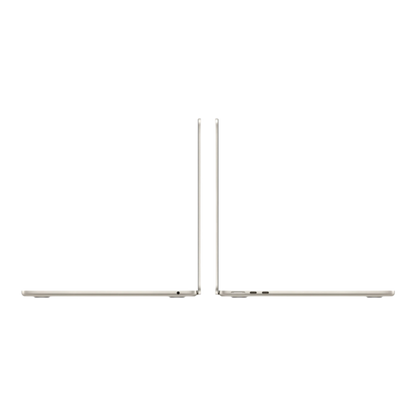 MacBook Air M5 13-inch in Starlight finish, showcasing its sleek profile and ports from a side view.