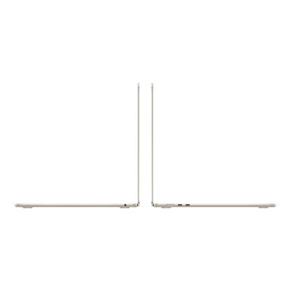 Image of two MacBook Air laptops in Starlight finish, showcasing their sleek design from a side angle.