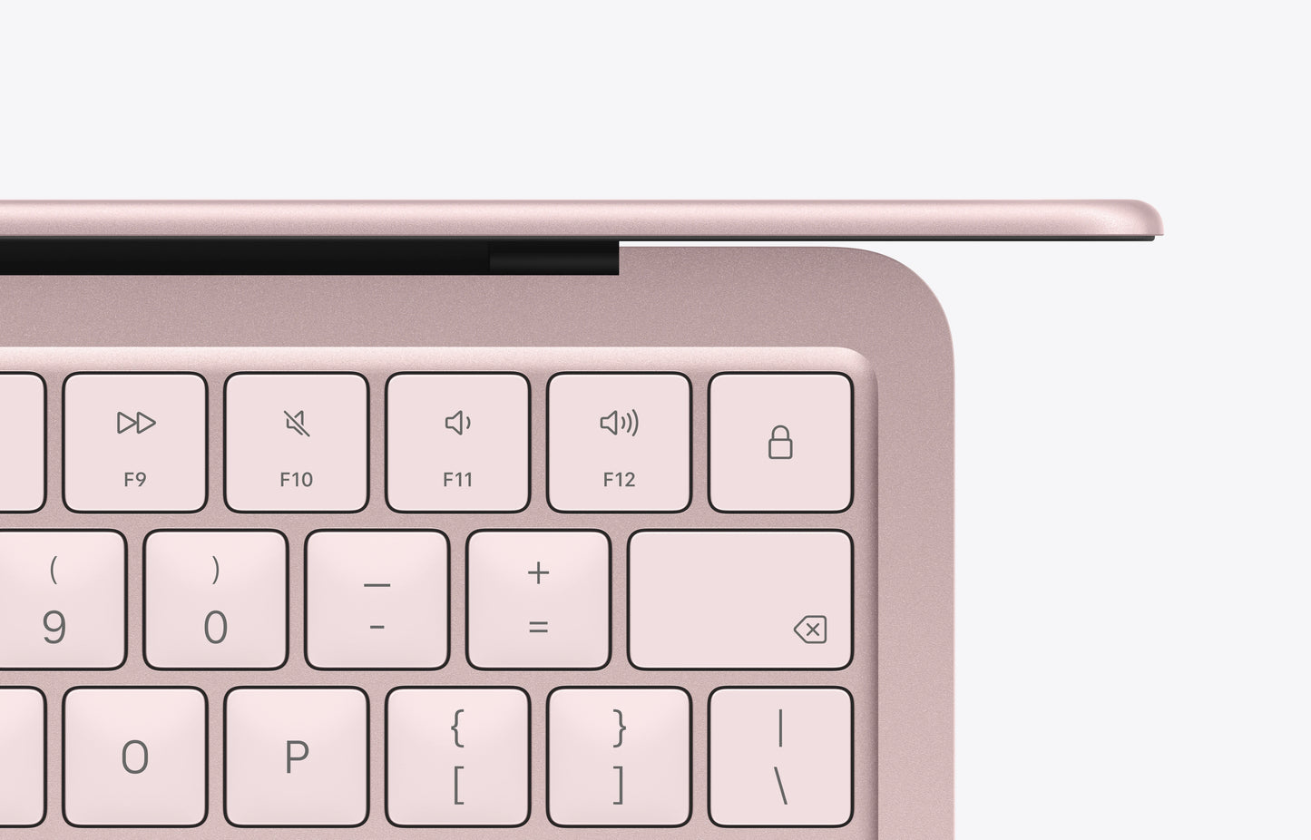 A close-up view of the blush MacBook Neo keyboard, highlighting function keys and an elegant design.