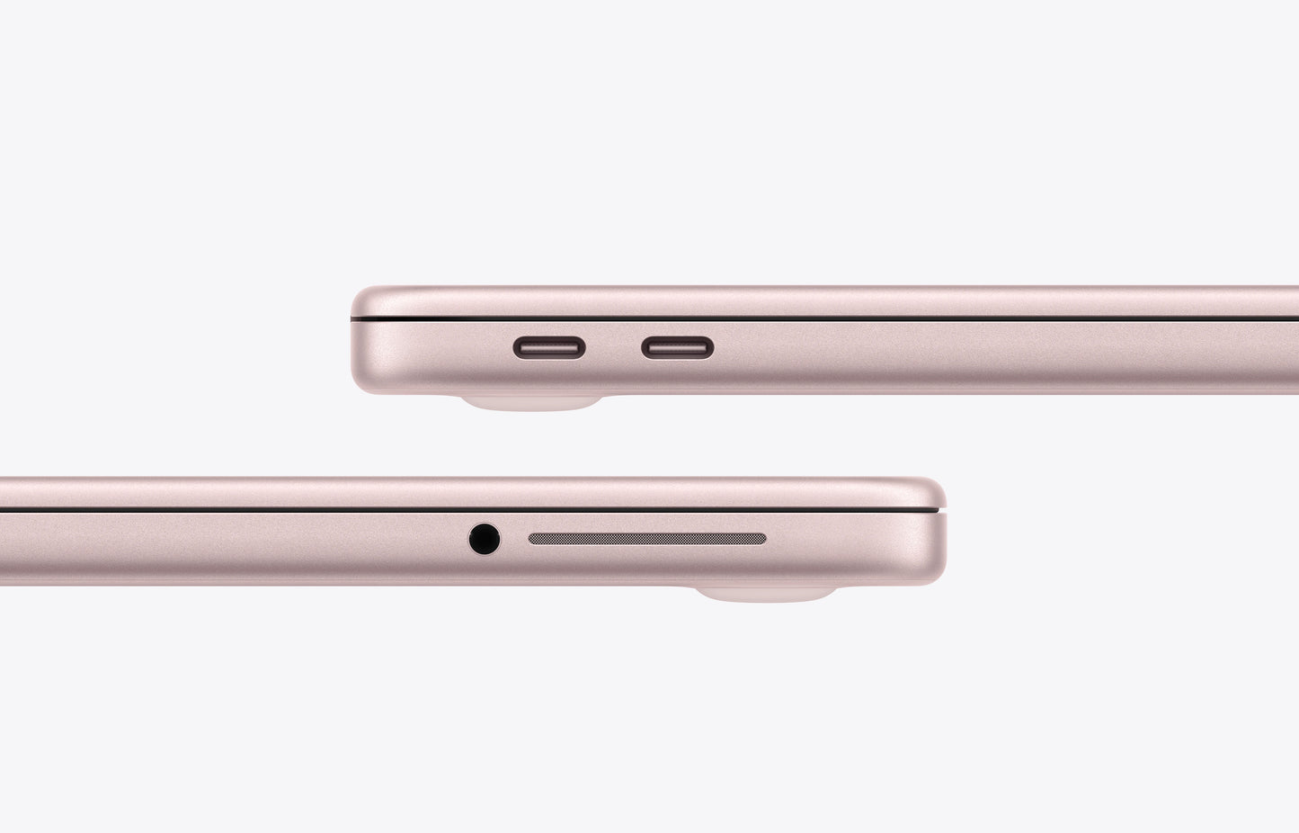 Side view of a blush-colored MacBook Neo showcasing USB-C ports and headphone jack.
