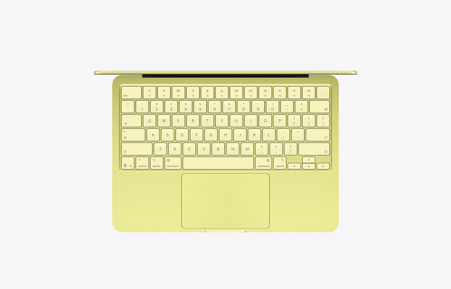 Top view of a yellow MacBook Neo Citrus with a 512GB SSD, showcasing the keyboard and trackpad.