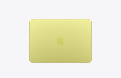 Apple MacBook in a vibrant citrus yellow color, seen from the back with a logo prominently displayed.
