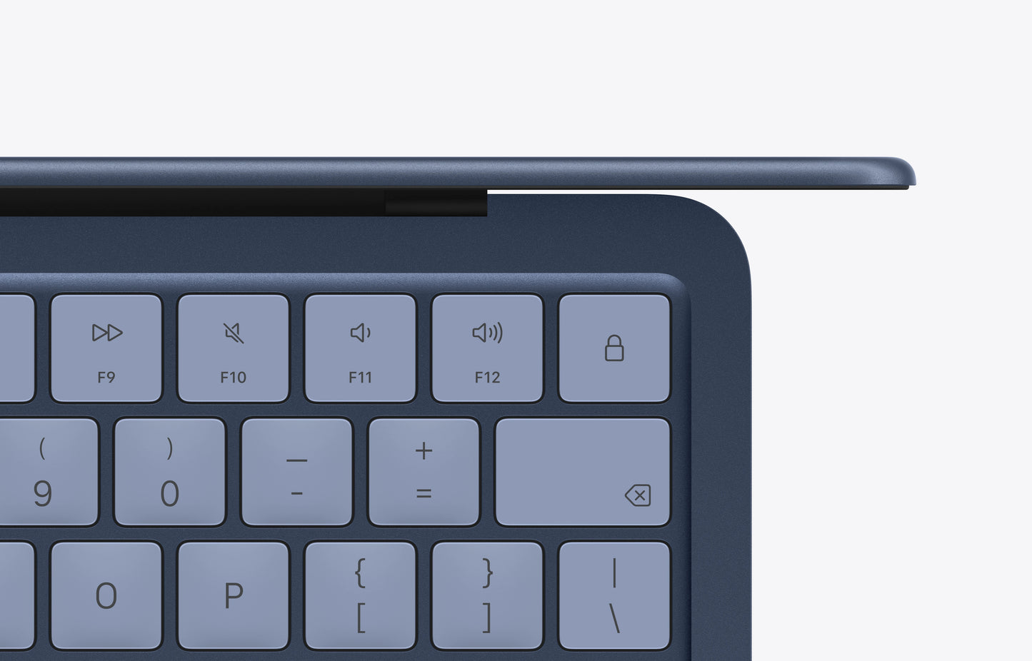 Close-up view of the indigo keyboard on a MacBook Neo with visible function keys and a sleek design.