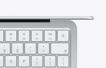 Close-up view of the keyboard on a silver MacBook Neo with function keys and numeric keys highlighted.