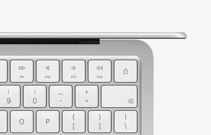 Close-up view of the keyboard on a silver MacBook Neo with function keys and numeric keys highlighted.