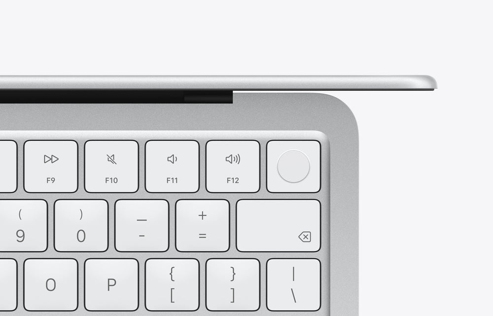 Top view of a silver MacBook Neo keyboard, featuring function and multimedia keys.