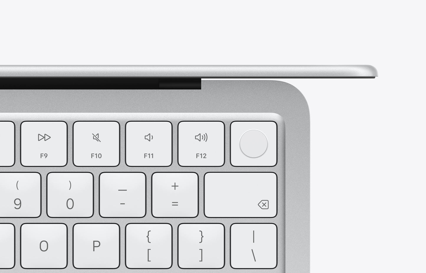 Top view of a silver MacBook Neo keyboard, featuring function and multimedia keys.