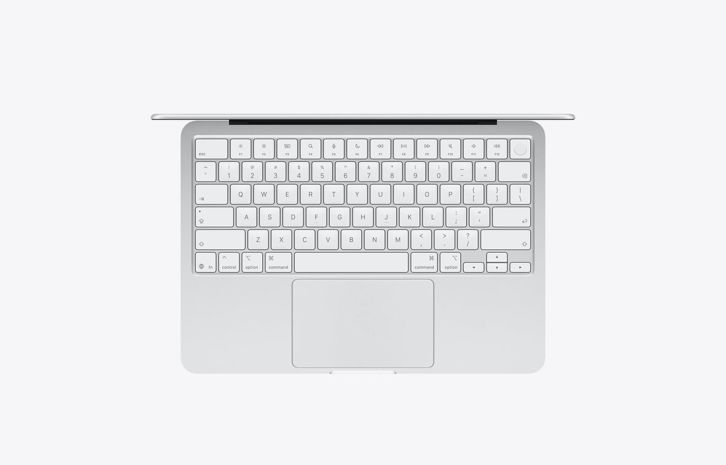 Top view of a silver MacBook with a 512GB storage capacity, showcasing its keyboard and trackpad.