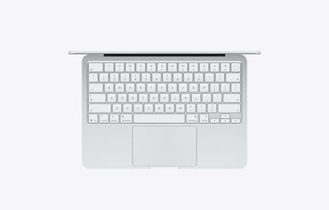 Top view of a silver MacBook with a 512GB storage capacity, showcasing its keyboard and trackpad.