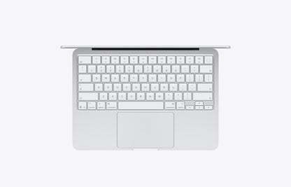 Top view of a silver MacBook with a 512GB storage capacity, showcasing its keyboard and trackpad.