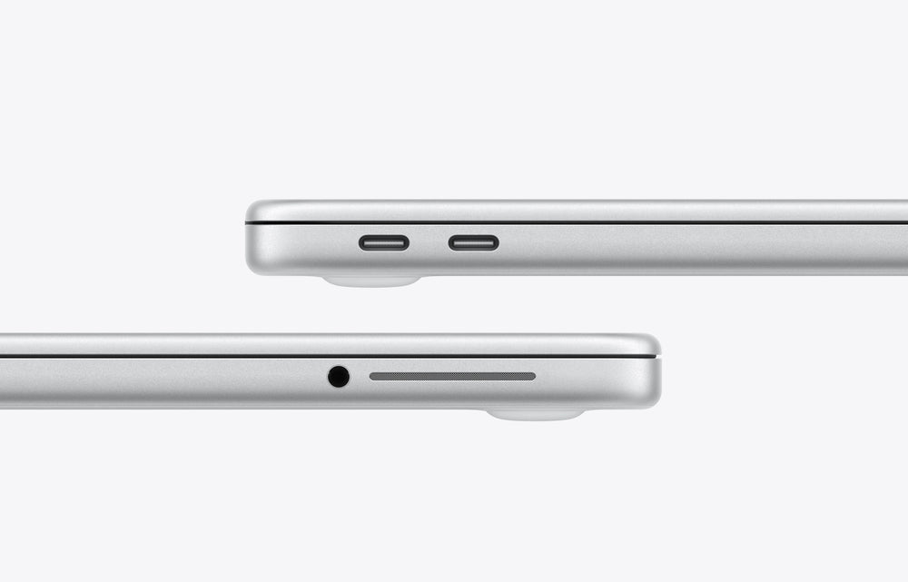 Silver MacBook Neo showing USB-C ports and headphone jack on the side.