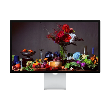 Computer monitor displaying a colorful arrangement of fruits, vegetables, and flowers.
