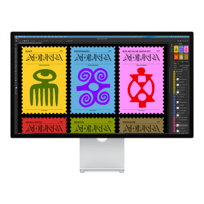 A monitor displaying colorful graphic designs of various stamps with African-inspired patterns and symbols.